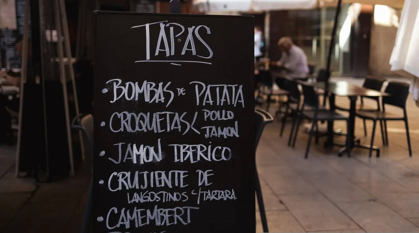 Handwritten tapas menu on a blackboard in Barcelona.
