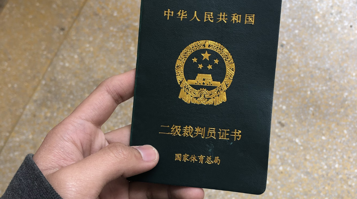Chinese passport in someone’s hand