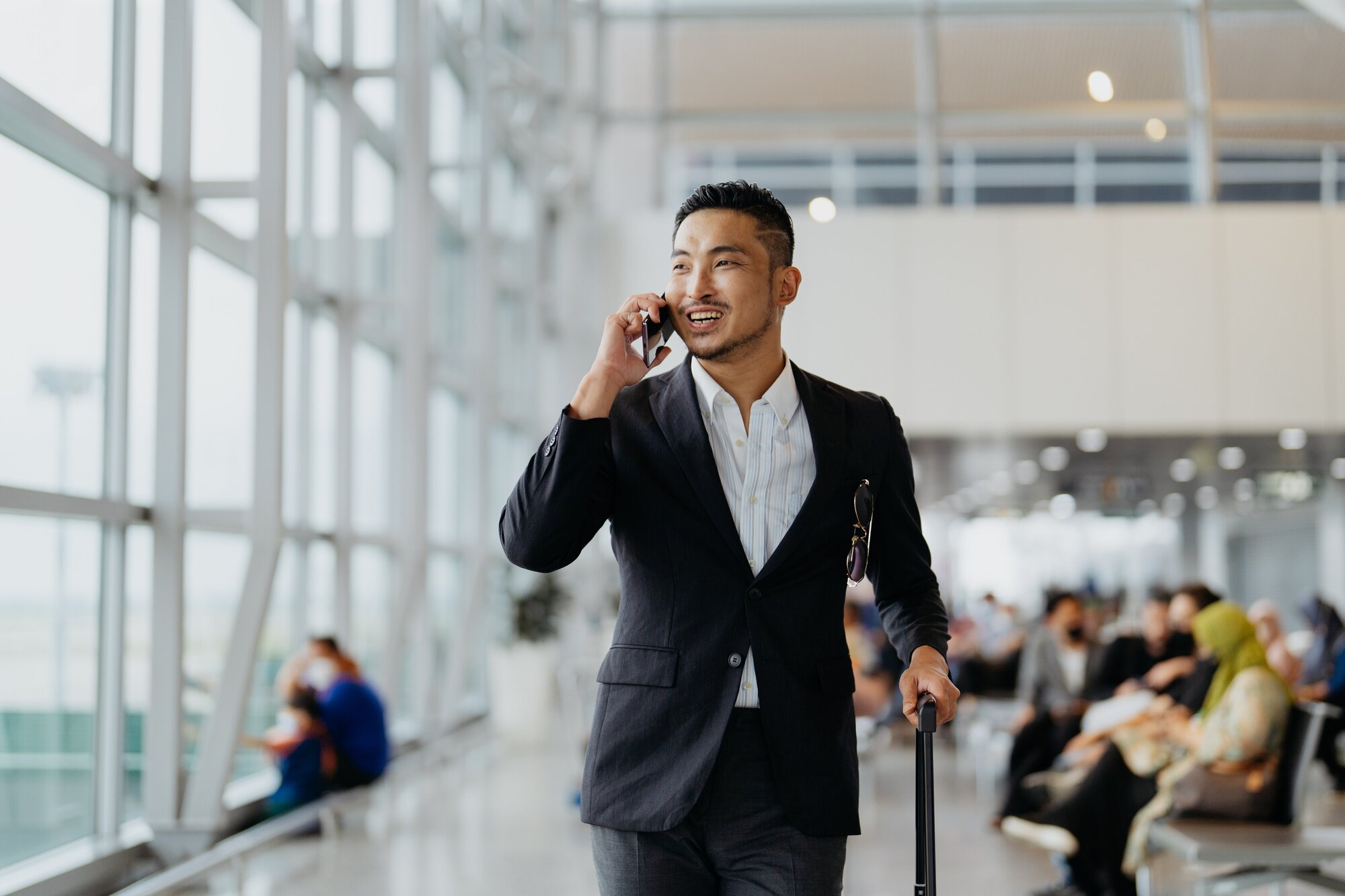 Business man walking through an airport