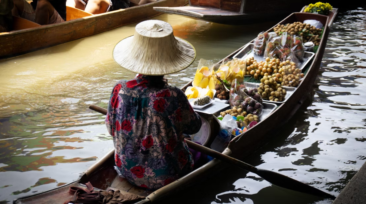 Fruit vendor at a floating market in Thailand
