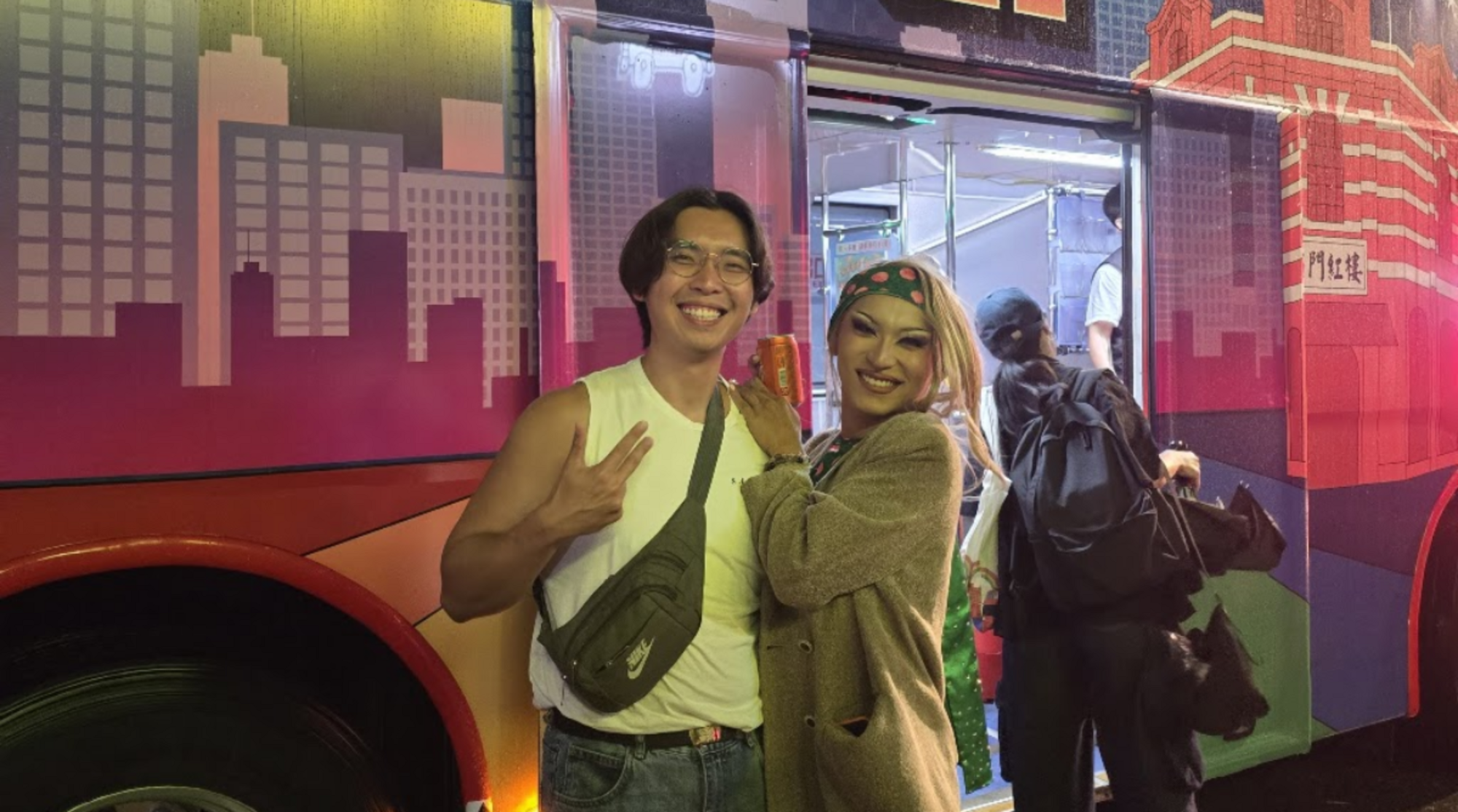 Alt text: Photo of a man posing with Taiwanese drag queen, Hannah Monina