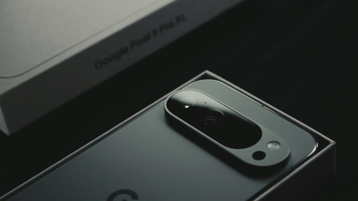 Close-up of a Google Pixel 9 Pro XL in its box, camera bar in focus, representing newer Google Pixel eSIM compatibility and eSIMs for travel, to illustrate a blog post entitled 'Are Google Pixel Phones eSIM Compatible?'