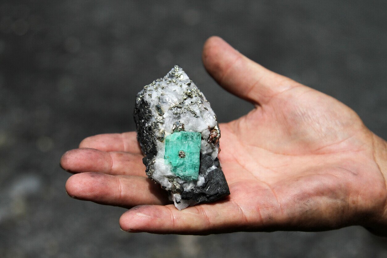 Emerald from Colombia in a person's hand
