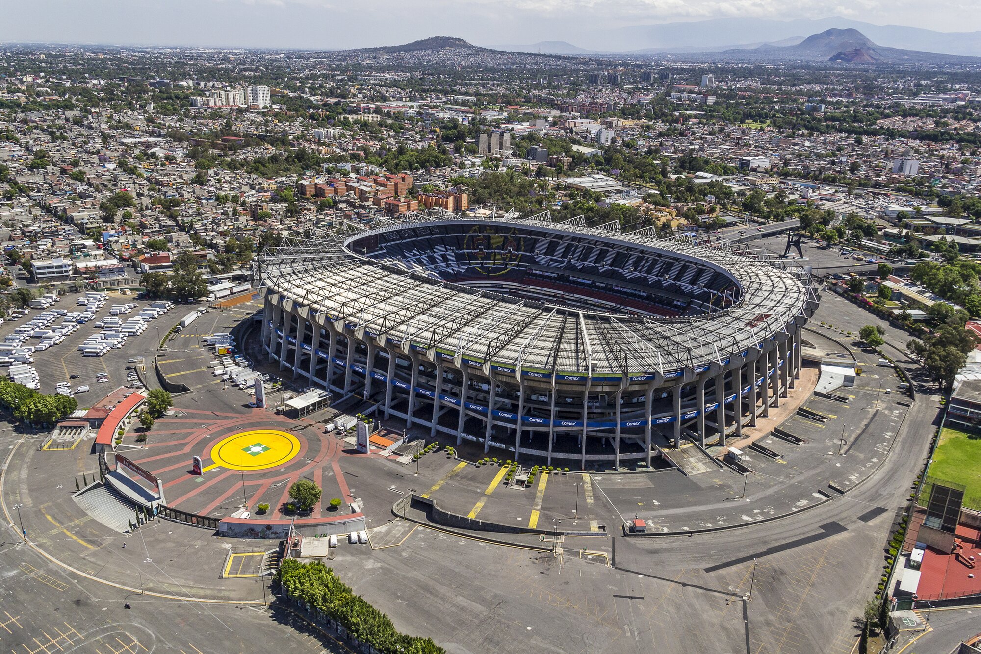 Mexico City Stadium Azteca surrounded by the Mexico City skyline