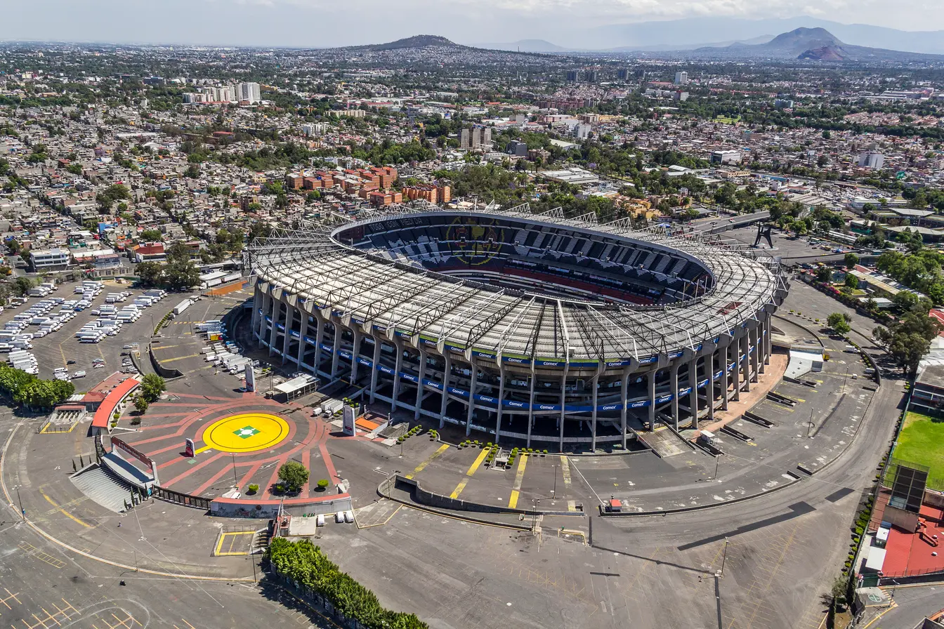 Mexico City Stadium Azteca surrounded by the Mexico City skyline
