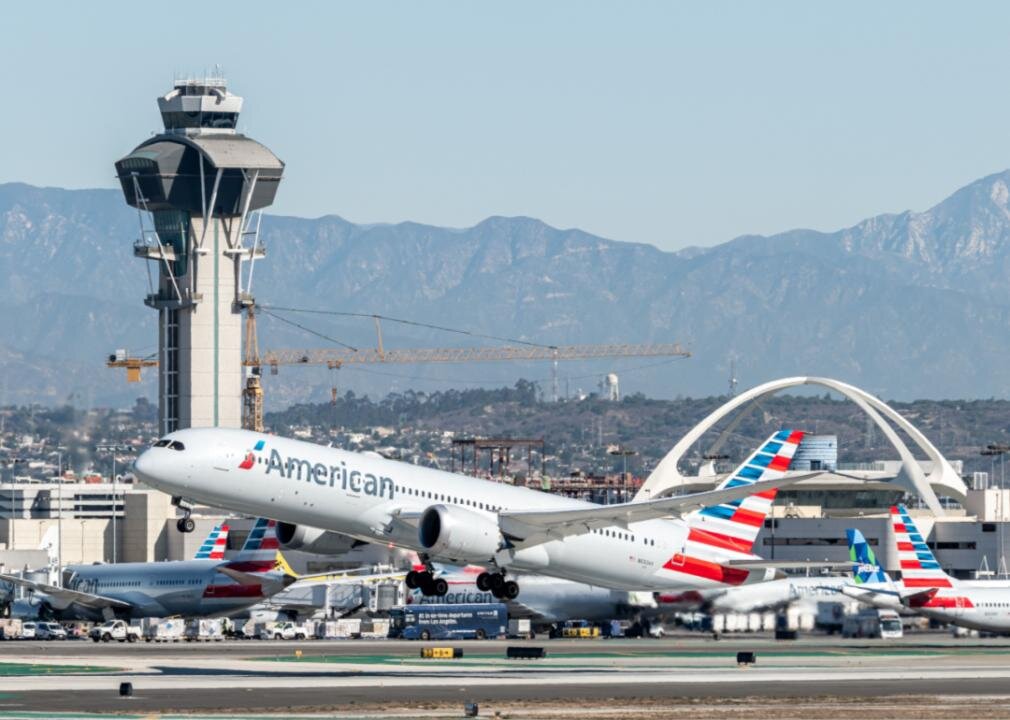 An American Airlines airplane taking off from an airport runway.