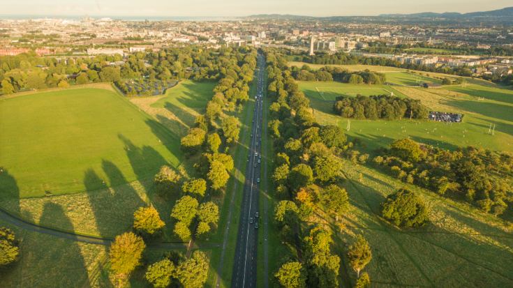 Arial photo of Phoenix Park in Dublin, showing expansive green fields, roads and trees.