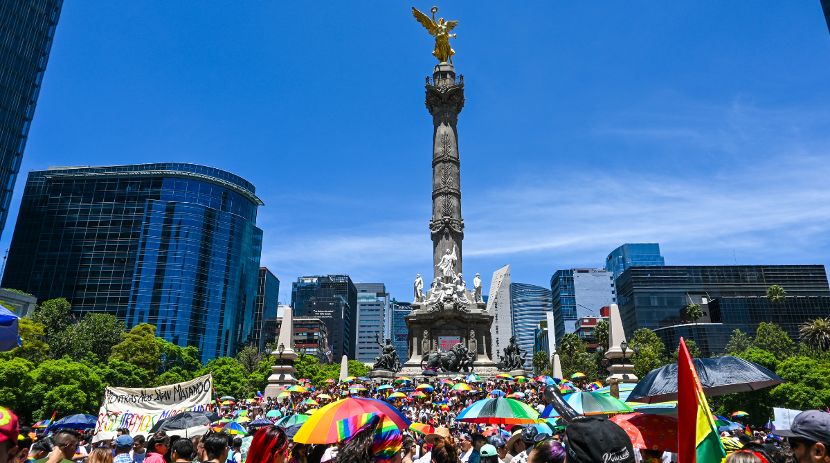 The Angel of Independence and parade attendees during the Mexico City Pride march in 2023.