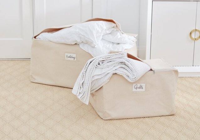 Two beige storage bags labeled 