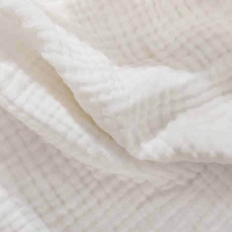 A white cotton blanket.