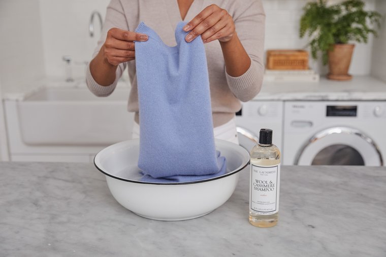 Hand washing with The Laundress Wool & Cashmere Shampoo