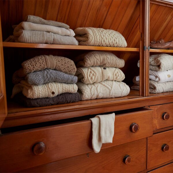 sweaters in a closet