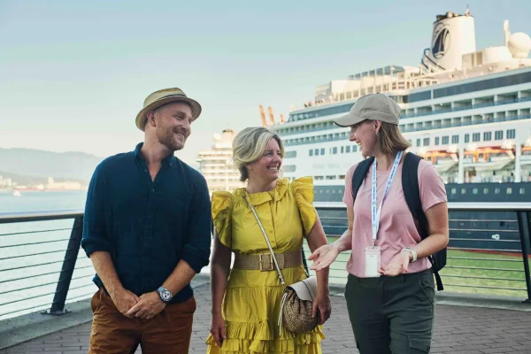 Three individuals explore near a cruise ship, engaged in a shore excursion with ToursByLocals