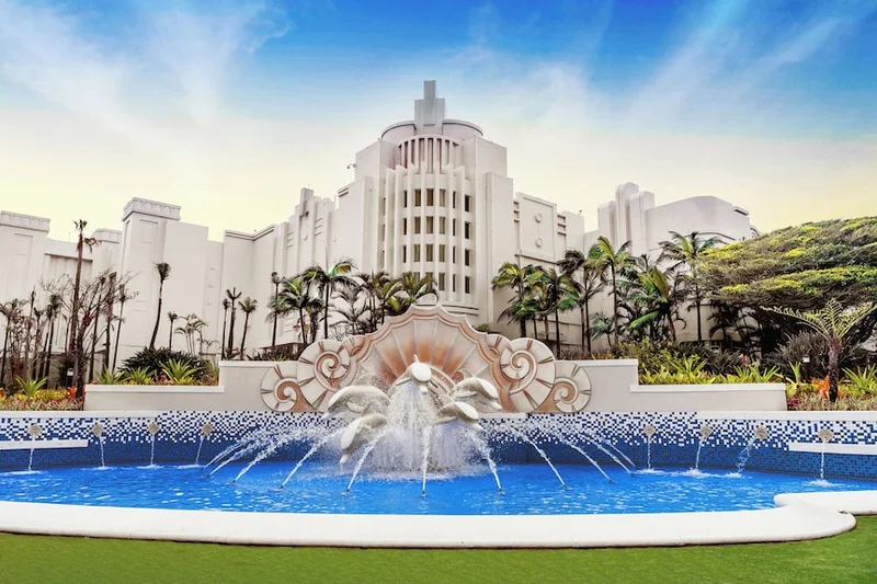 Luxury oceanfront hotel with fountains and pool