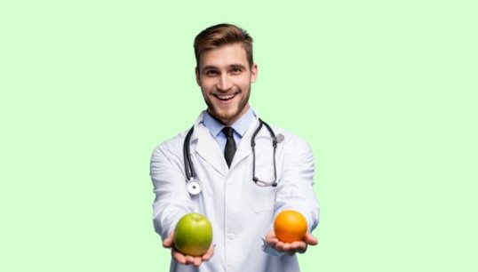 doctor holding 2 apples with green background