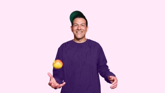 man throwing apple