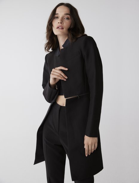 Picture of a women in a longline black blazer
