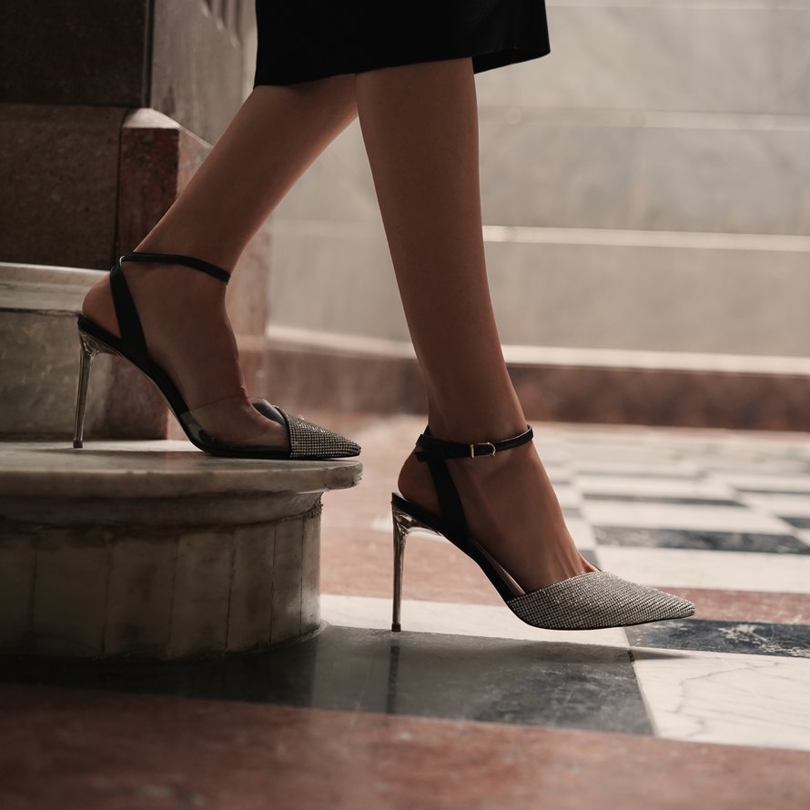 High heels with rhinestones walking down steps