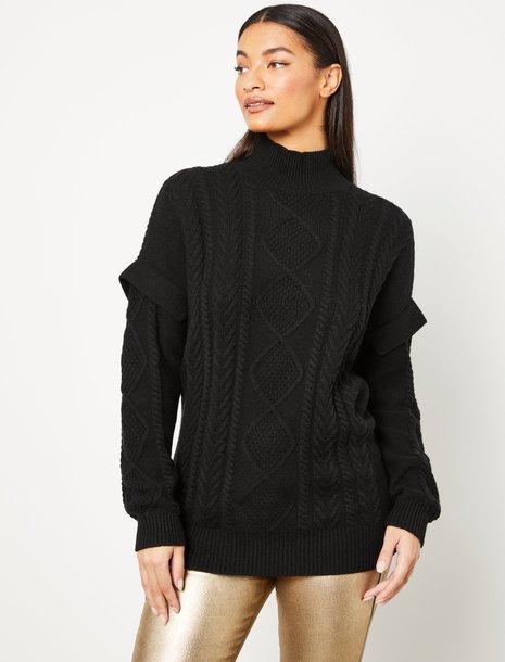 Picture of a woman wearing a black chunky sweater