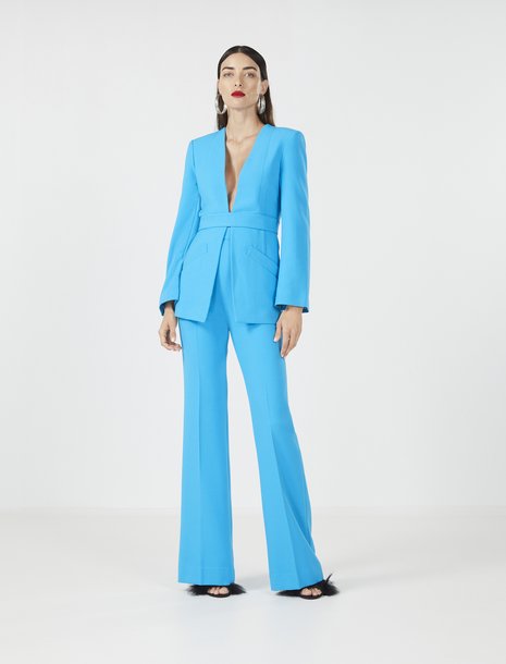 Picture of a women in bright blue suit set