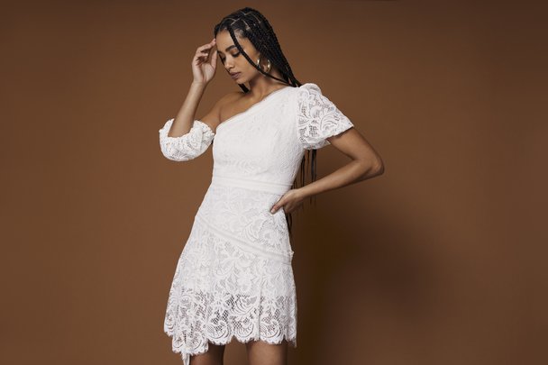 woman in white feminine lace top