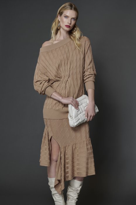 Picture of a woman in a taupe beige sweater skirt set