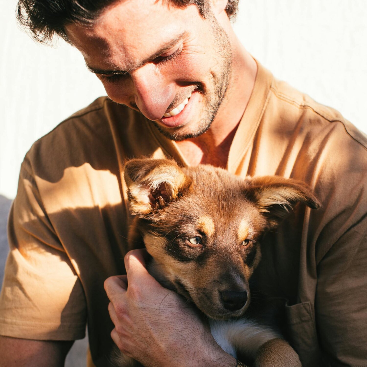 Man holding puppy