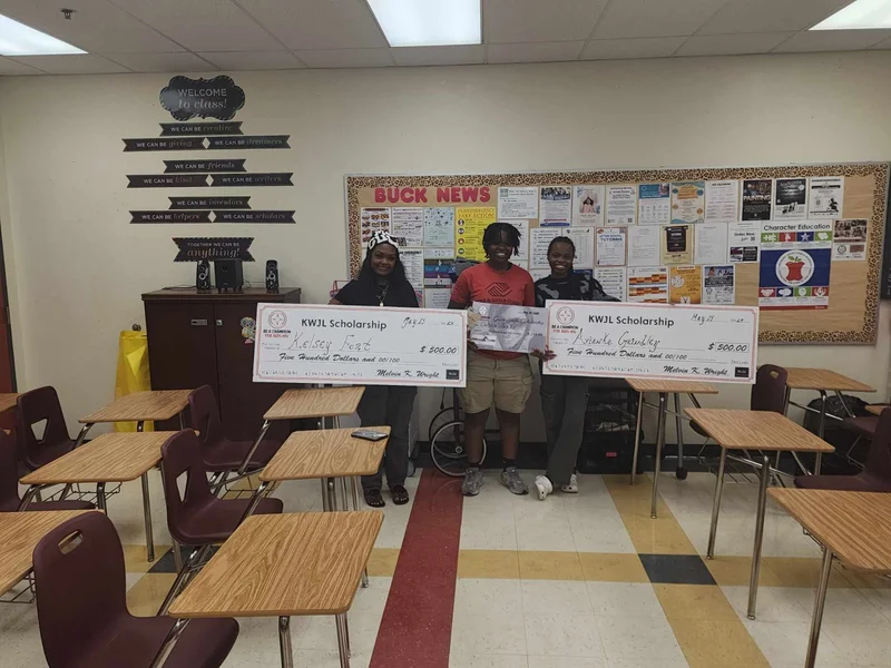 Students holding KWIL Scholarship certificates