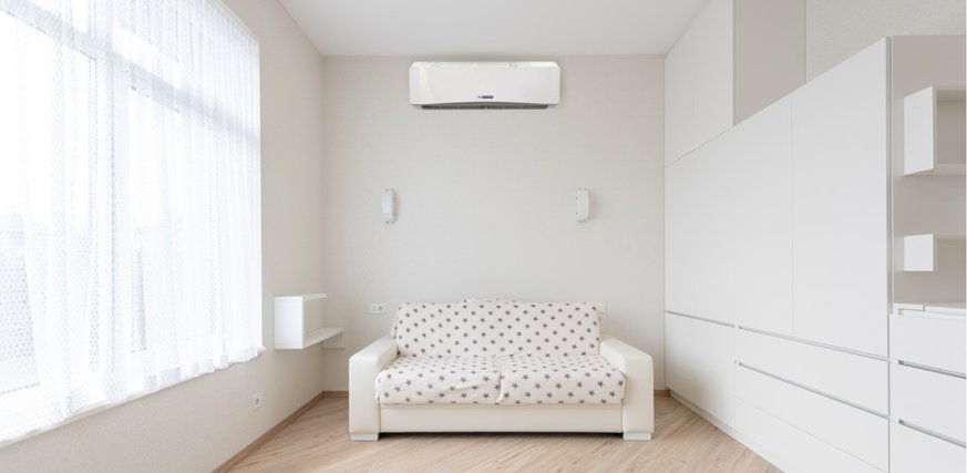 Bedroom showing Blueridge ductless mini split air handler mounted on the wall.