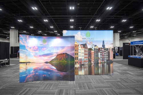 Trade show displays from Ace Displays in an aisle of a trade show.