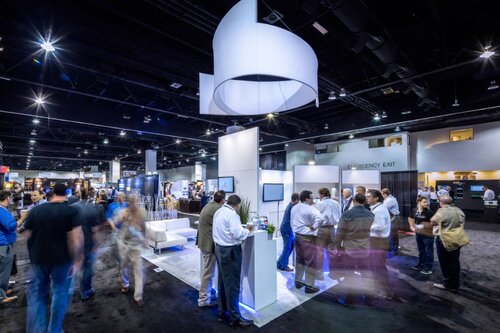 An example of a trade show booth with a hanging sign to increase visibility.