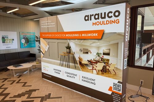 Arauco's trade show display from Ace Displays. Home furnishings are displayed on the flat backlit display. The display is atop patterned tile.
