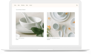 Online store built by artist selling pottery shown on a laptop.