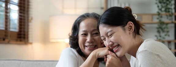 Family members sharing a warm moment at home. Herewith helps families plan care with trusted Helpers and clear, supportive options.