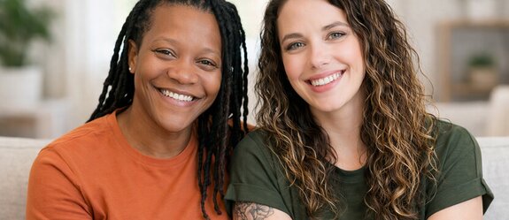 A Helper assists a senior woman with reading and daily engagement activities at home. Herewith provides flexible in-home senior care focused on dignity, independence, and meaningful connection.