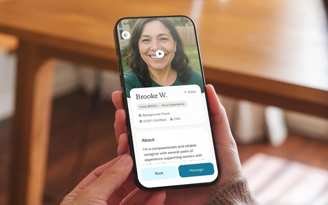 User holds a phone displaying the profile of a Helper with a CCHT-certified badge. 