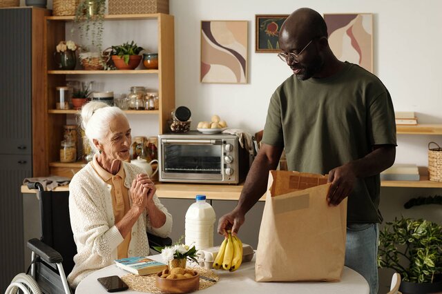 A Helper gently supports an older adult at home. Herewith connects families with reliable Helpers for safe, everyday in-home care.