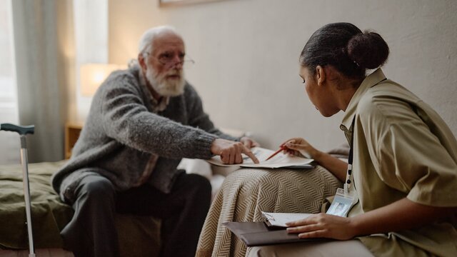 A Helper gently supports an older adult at home. Herewith connects families with reliable Helpers for safe, everyday in-home care.