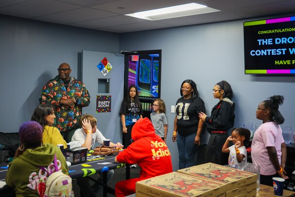 SugaBear speaking to listeners at Slick City