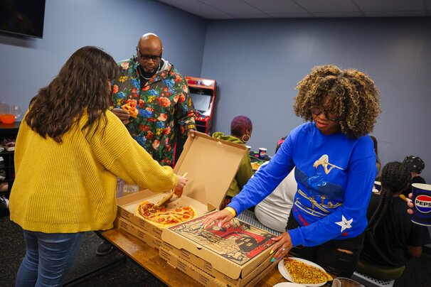The Drop Crew and pizza with listeners at Slick City