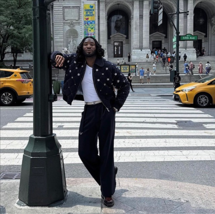 Odeal standing on a street corner in New York City