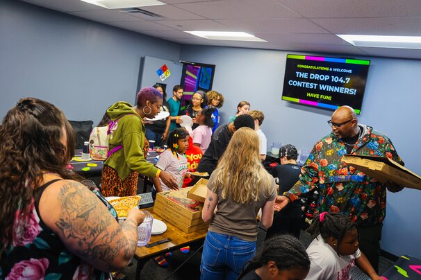 The Drop Crew having pizza with listeners at Slick City