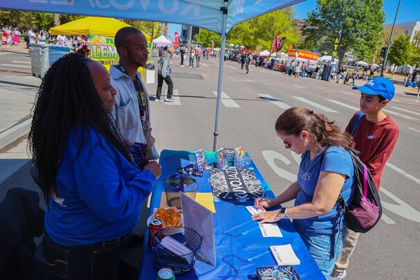 KUVO JAZZ fans at booth with Kim Berry at Cinco de Mayo