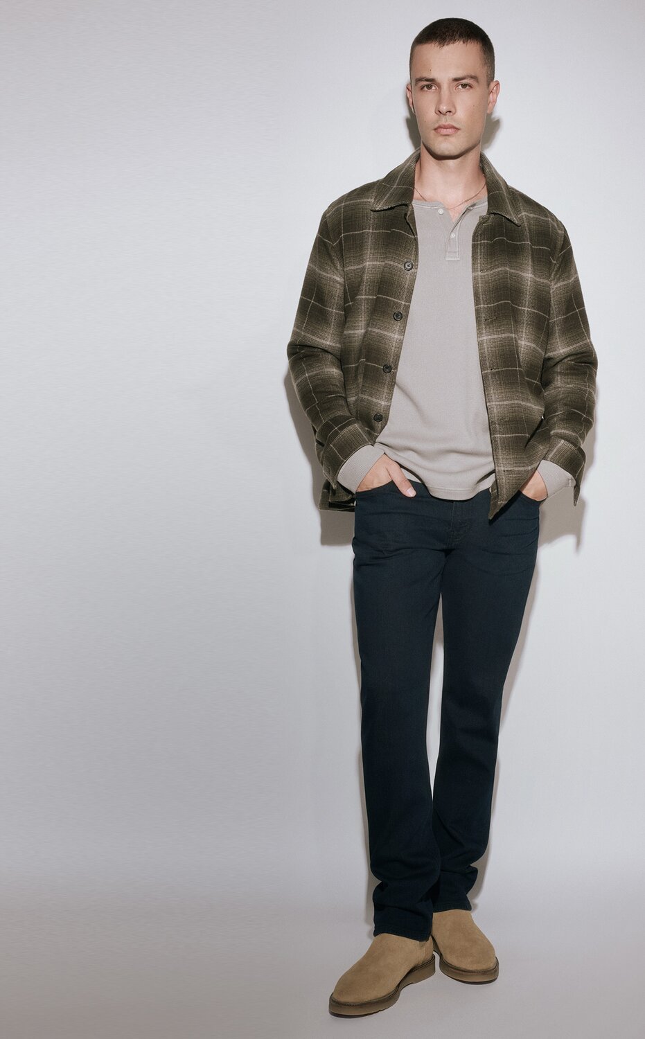 A collection of PAIGE denim jeans in an array of washes from light to dark