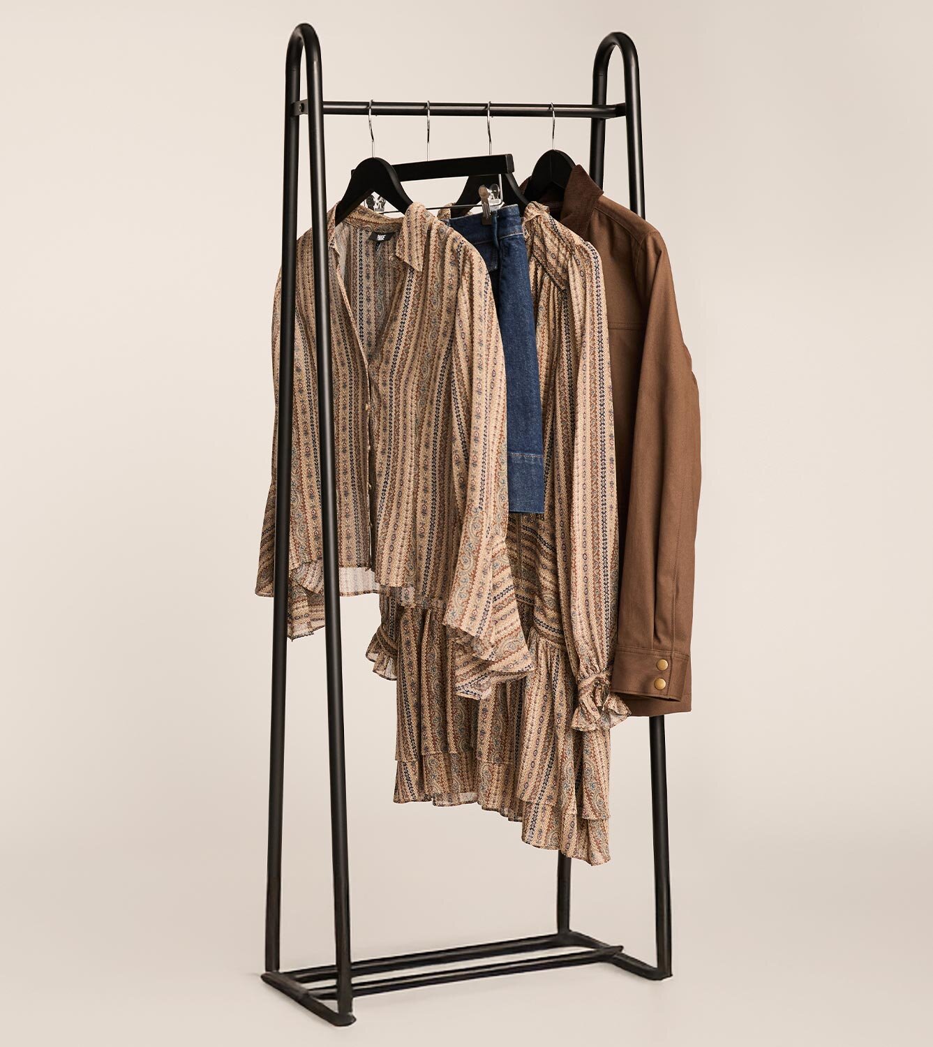 Stack of men's and women's folded clothing