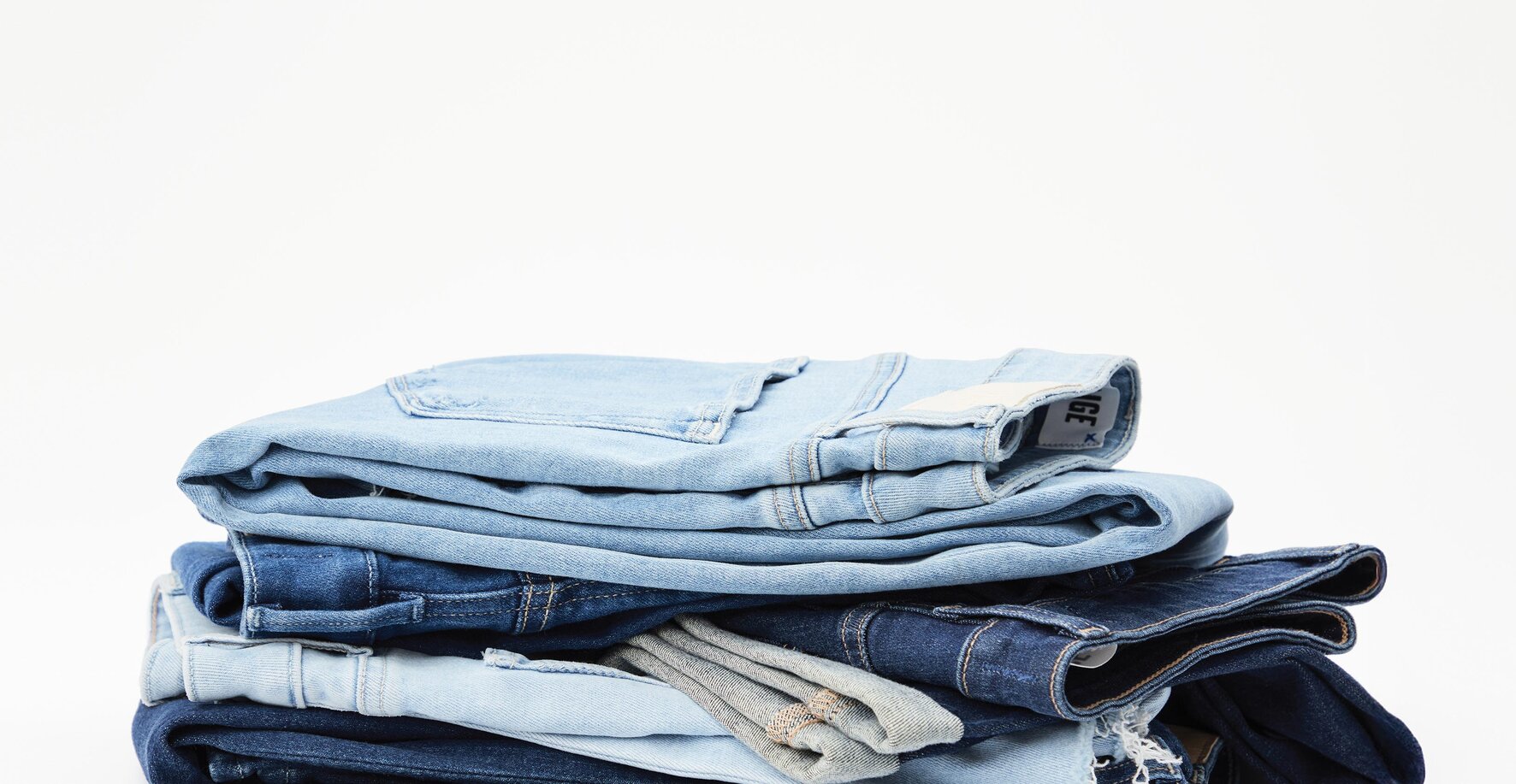 Stack of denim jeans