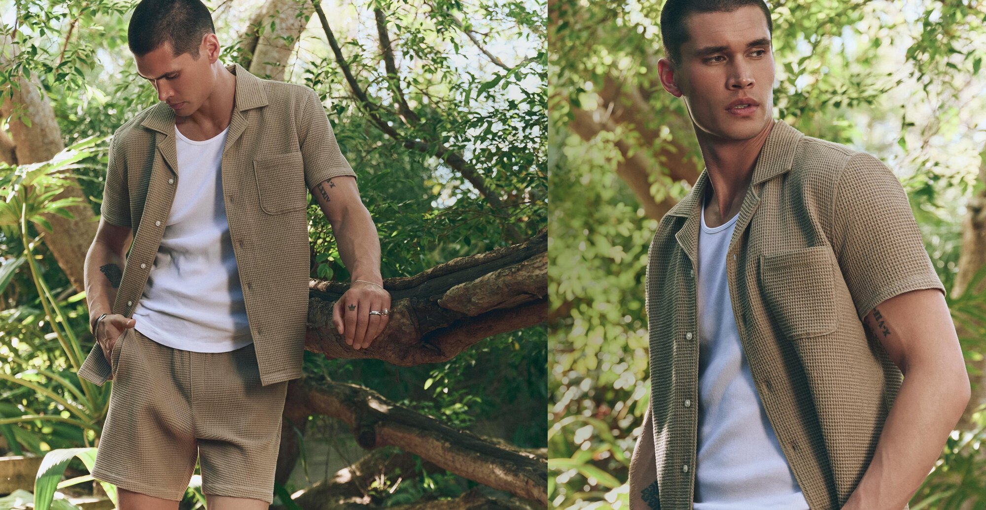 Man wearing a matching brown short sleeve button up shirt and short set and a white tank top underneath