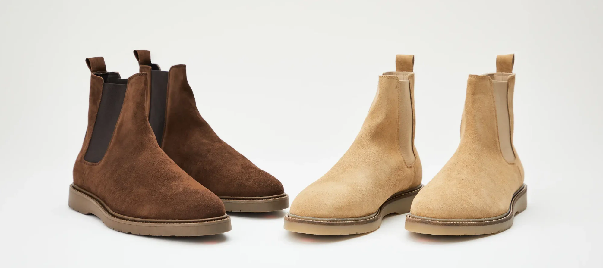 Two pairs of suede Chelsea boots in dark brown and tan