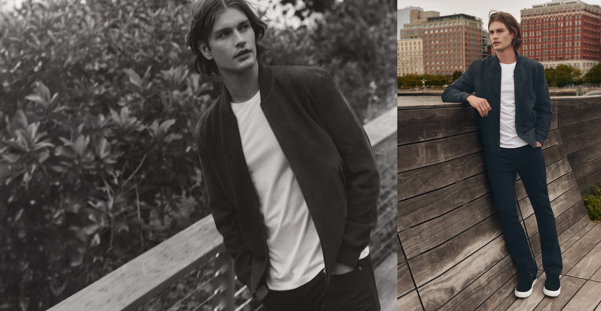 Man wearing a navy blue suede bomber jacket, a white t-shirt, and navy blue jeans