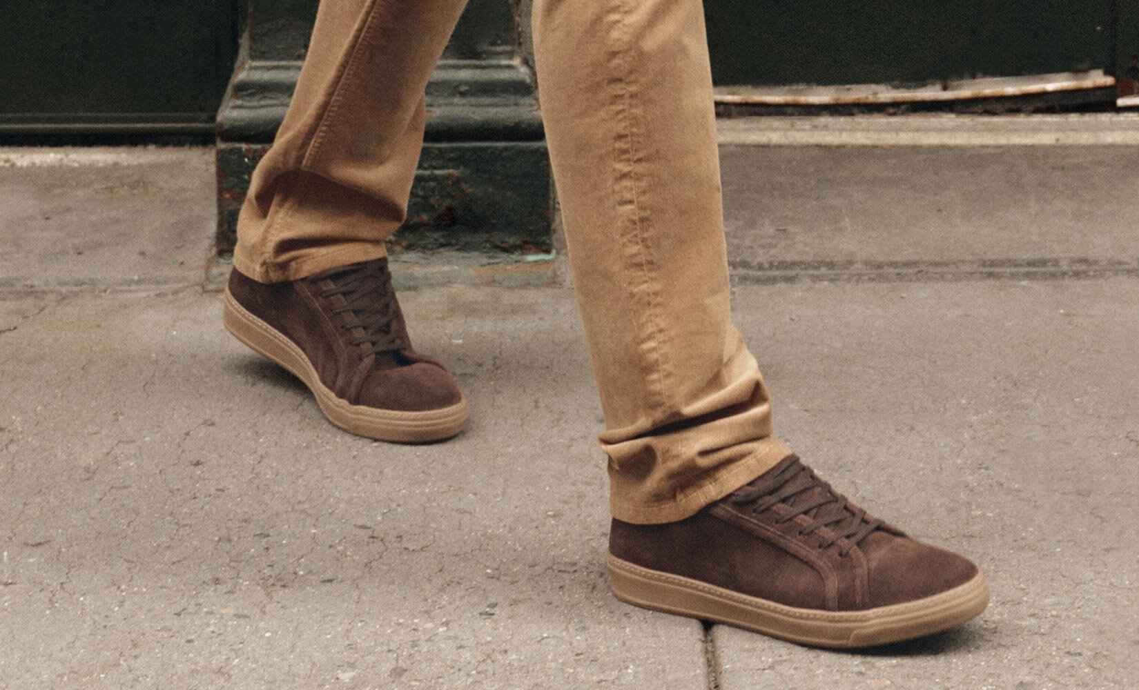 Man wearing light brown corduroy pants and brown sneakers